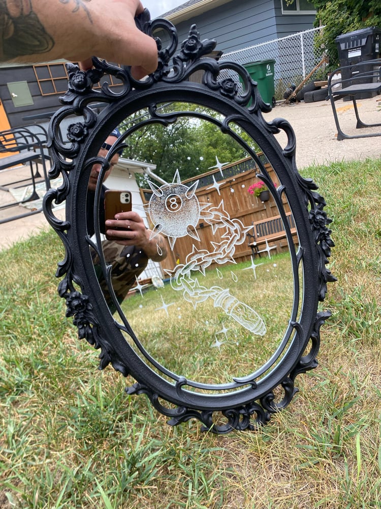Engraved mirror
