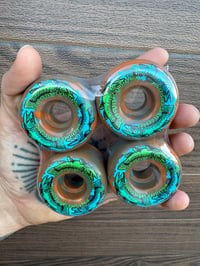 Image 2 of Orange Swirl Triple Trout 54mm Skateboard Wheels