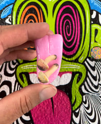 Double mushie tongue pendant 