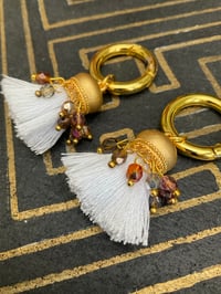 Image 2 of Gold plated white cotton and rainbow glass bead Afghan tassel tunnel earrings