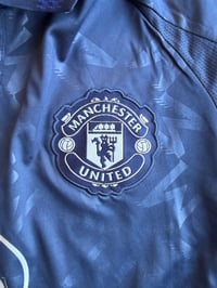 Image 2 of     Manchester United Navy Away Jersey 2024/25 – Snapdragon Edition