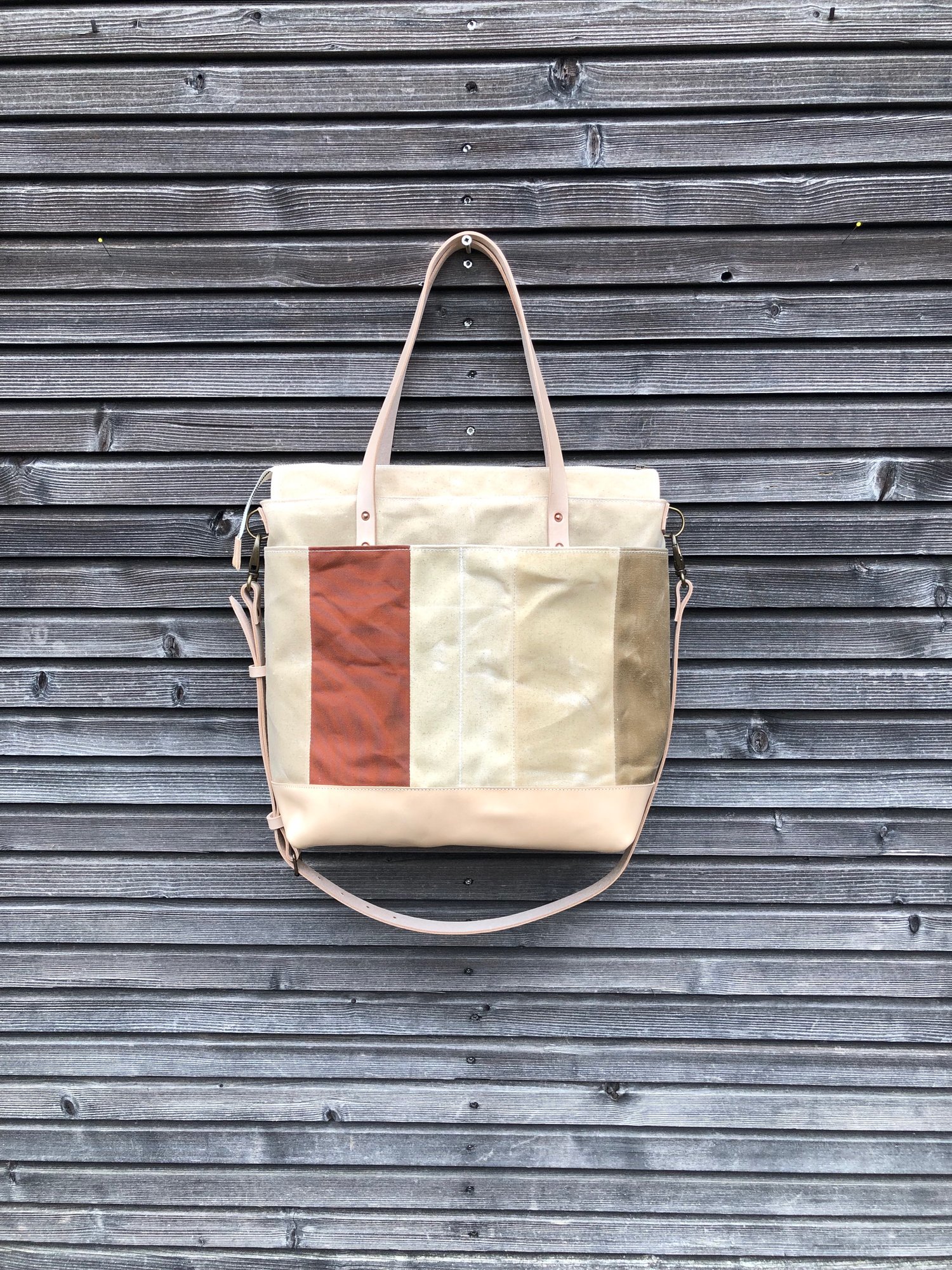 Image of  Large tote bag in waxed canvas and leather with cross body strap 