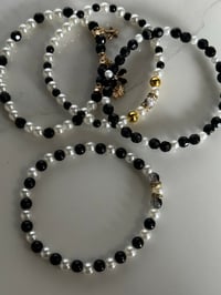Image 8 of Wild Blooms Black, Gold, and Cream Tumbler Bracelet Stack