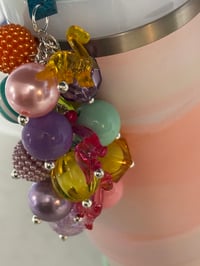 Image 4 of Warm Serene Brushstrokes Dinosaur Tumbler Accessory Set | Bow, Straw Bauble & Bracelets