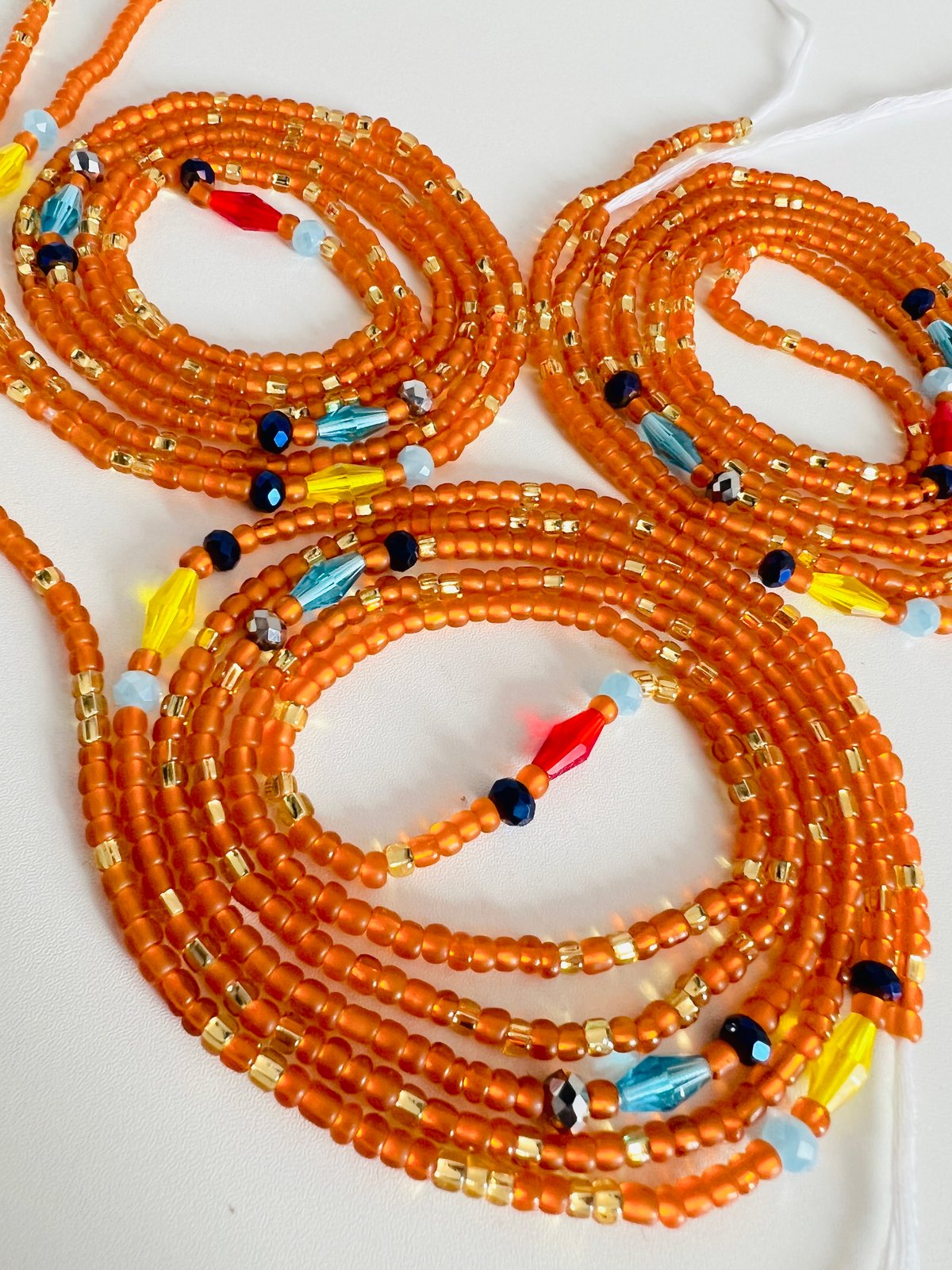 Orange waist best sale beads meaning