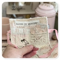 Image 9 of A Petite French tin with a needle book and tattered pin cushion