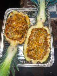 Image 1 of Pineapple Boats: Chicken, Smoked sausage & cheese or Shrimp, Smoked Turkey Sausage & Cheese