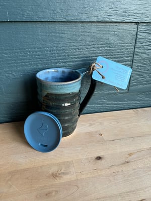 Image of M55 Large mug, black bum with blue inside—overlap is blue