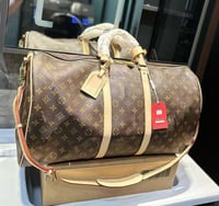 Brown mono duffle bag