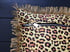 Leopard print fabric and red virgin of Guadalupe cushion cover with gold fringe Image 3