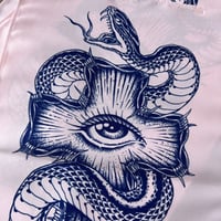 Image 1 of snake and cross (on fabric)