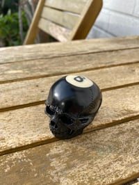 Image 1 of Solid stick top skull 8 ball.