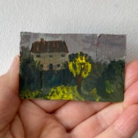 Cottage with yellow tree