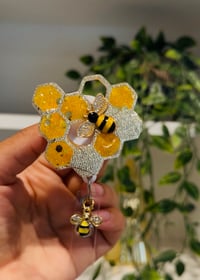 Image 1 of honey comb badge reel 