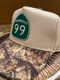 Image 3 of 99 Cream/Camo snap Back 
