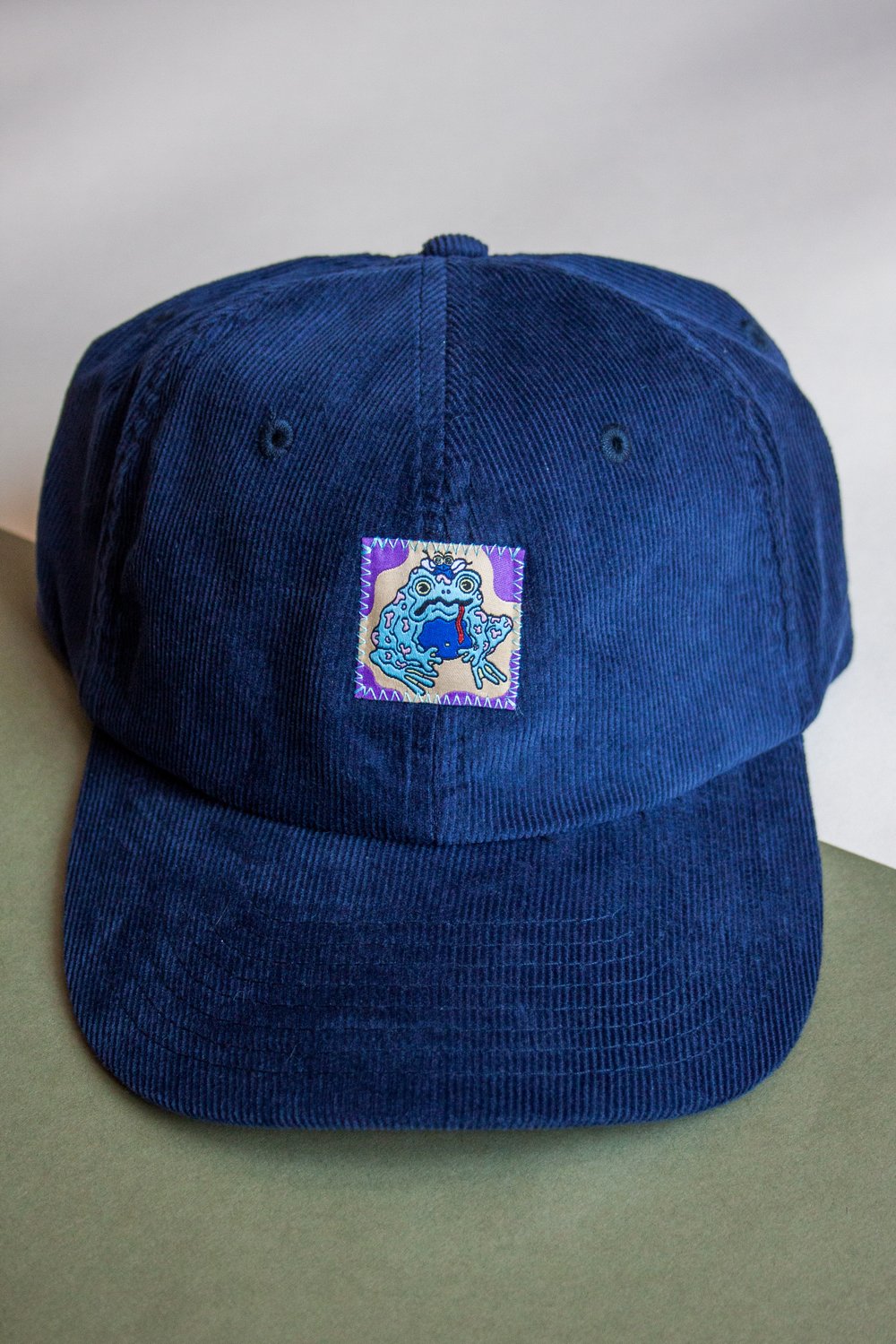 Image of Navy Psychedelic Frog Cord Cap