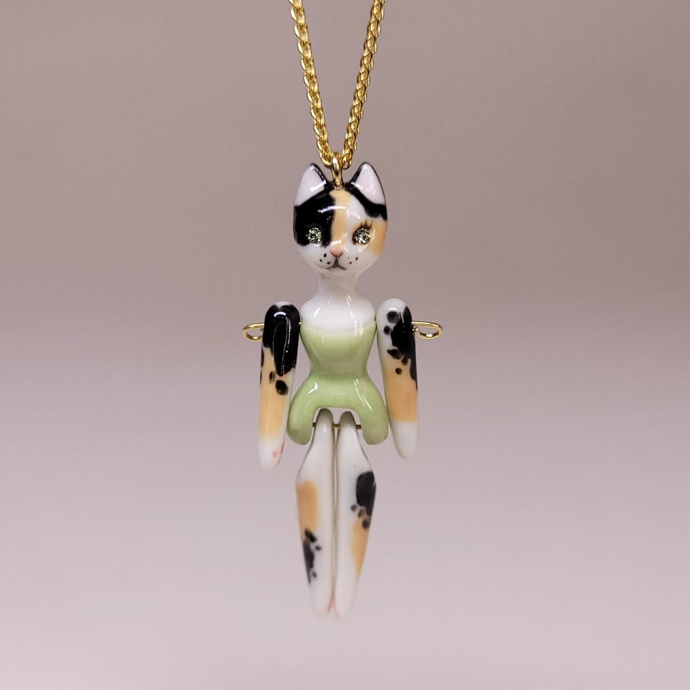 Image of Calico Porcelain & Gold Vermeil Articulated Doll Pendant