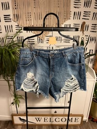 Image 1 of distressed denim shorts 