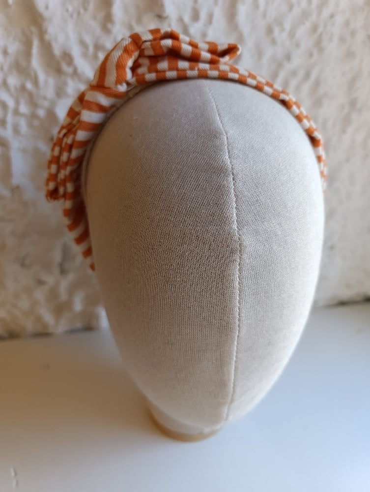 Image of Cerchietto a fiocco righe bianco/arancione