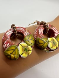 Image 1 of Chunky donuts patterned with cane work and seed beads. Price includes shipping.