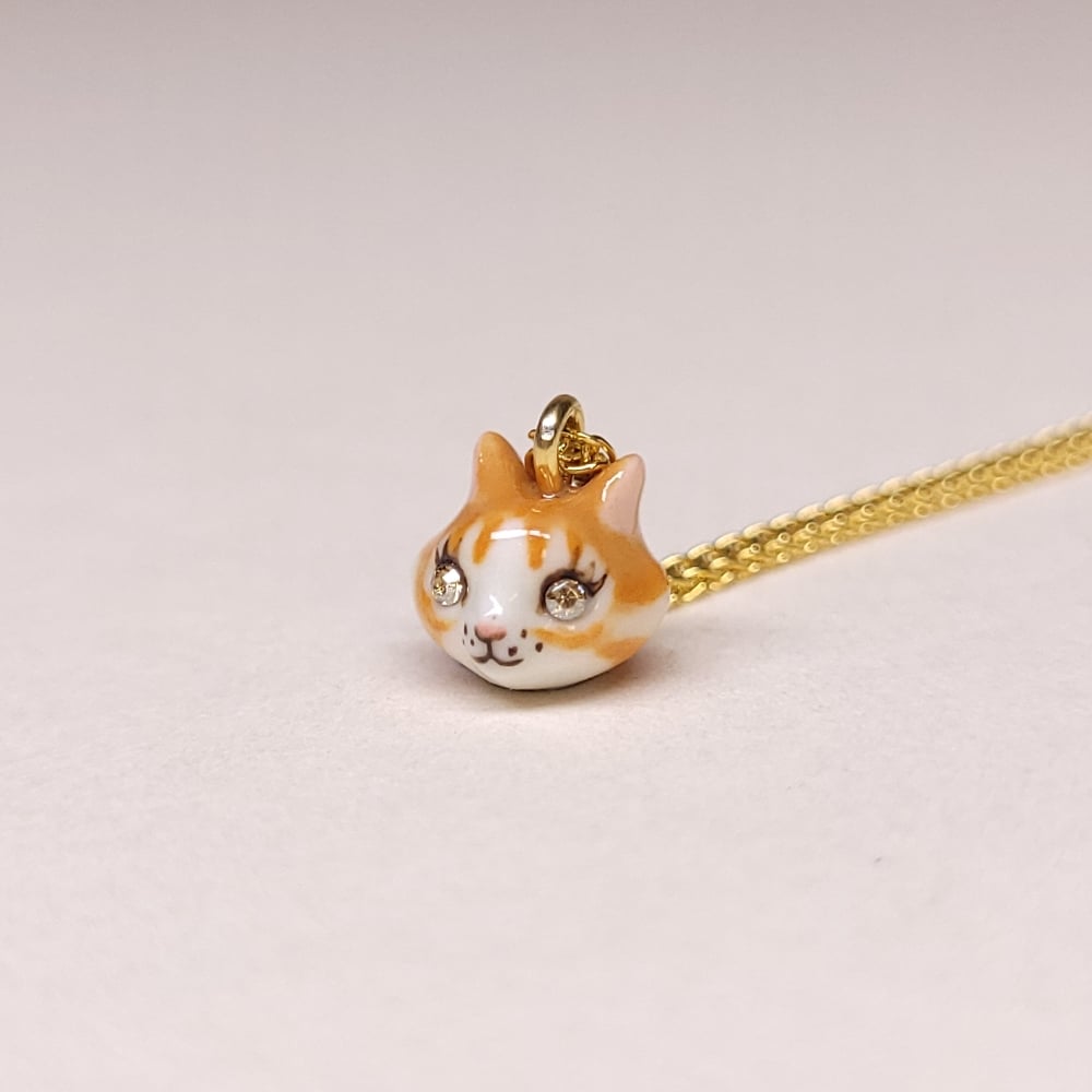 Image of Ginger Tabby Porcelain & Gold Vermeil Teeny Tiny Cat Pendant