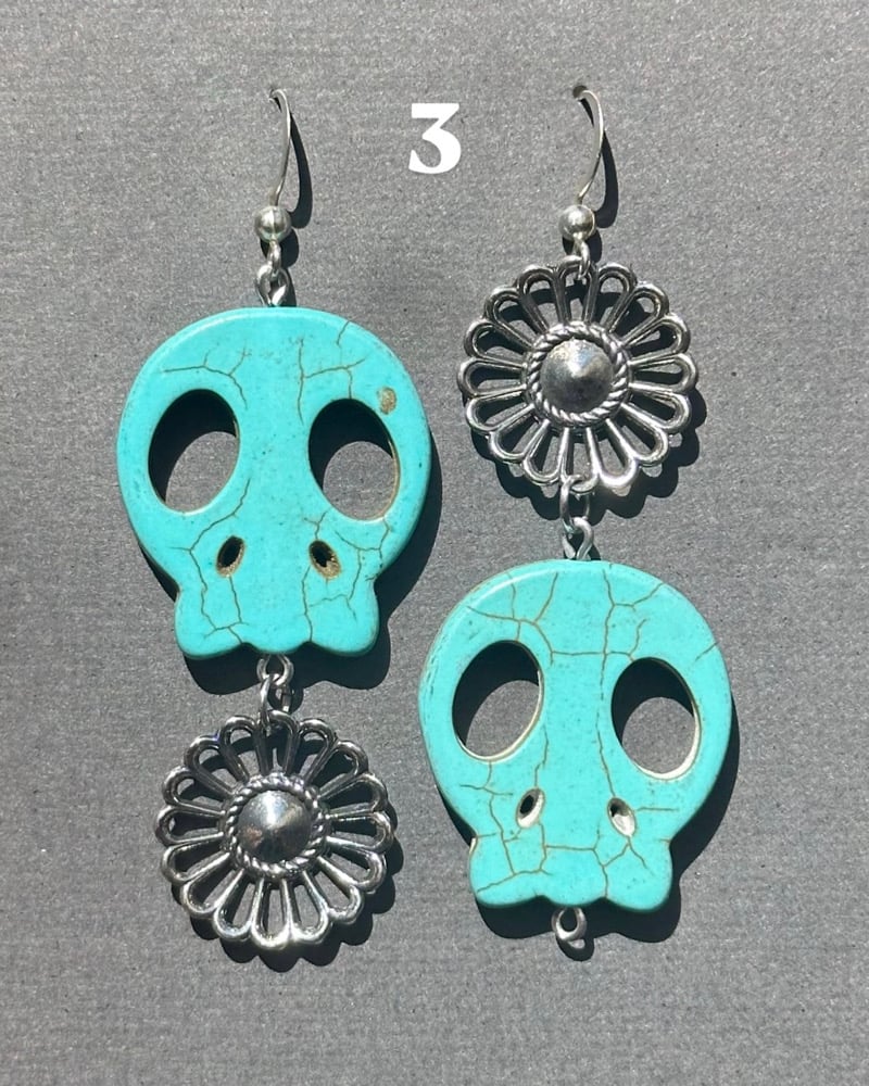 Image of blue skull earrings