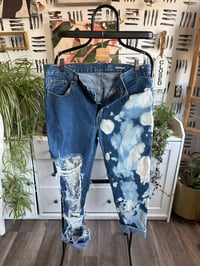 Image 1 of Distressed bleached denim jeans 