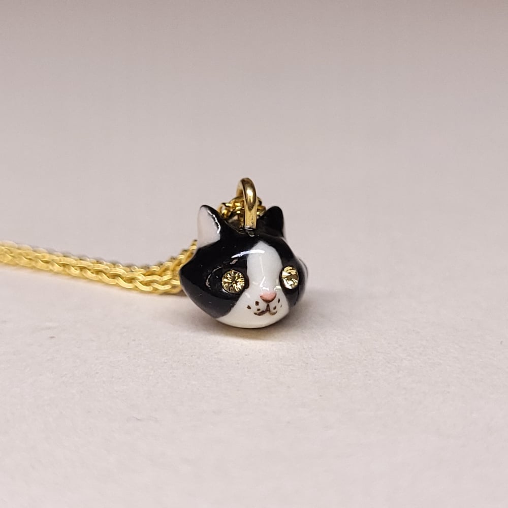 Image of Tuxedo Porcelain & Gold Vermeil Teeny Tiny Cat Pendant