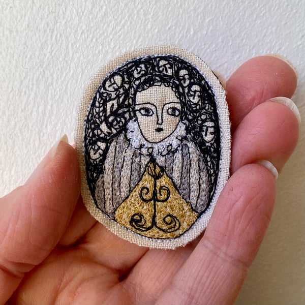 Image of Portrait of a woman with striped silver cape - smaller embroidery brooch 