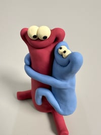 Image 3 of Blue thing hugging a red thing