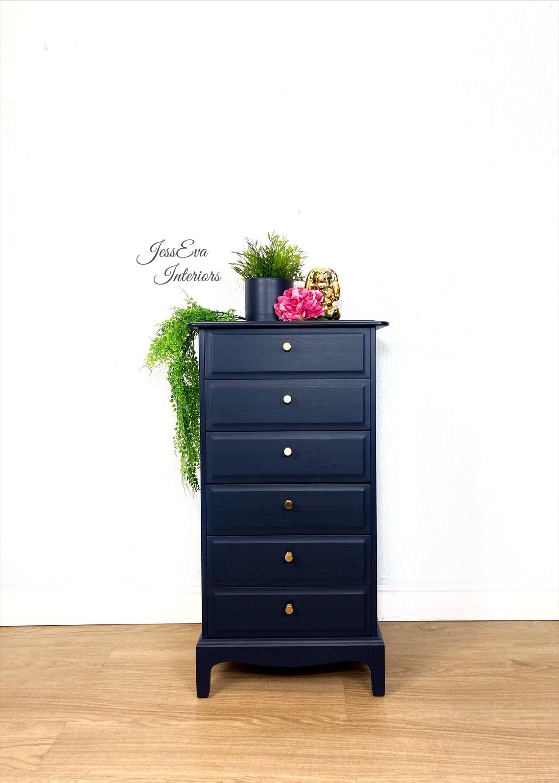 Stag Minstrel Tallboy / Chest Of Drawers painted in navy blue.