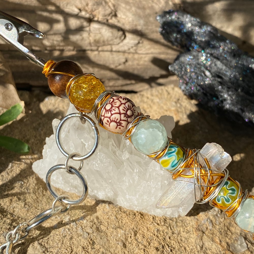 Image of sun flower roach clip