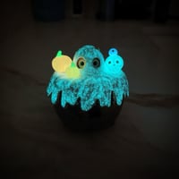 Image 14 of Glow in dark orange cat in witch brew cauldron ceramic keepsake (rainbow effect)