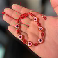 Image 1 of 7 knot bracelet with evil eyes