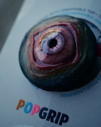 Image 8 of Custom Swappable Phone Grip for smartphones, reflective pupil, pink glow in the dark