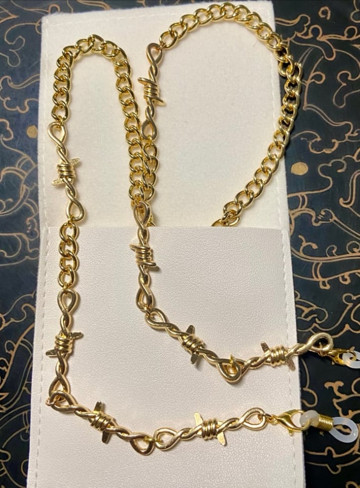 Image of gold barbed wire