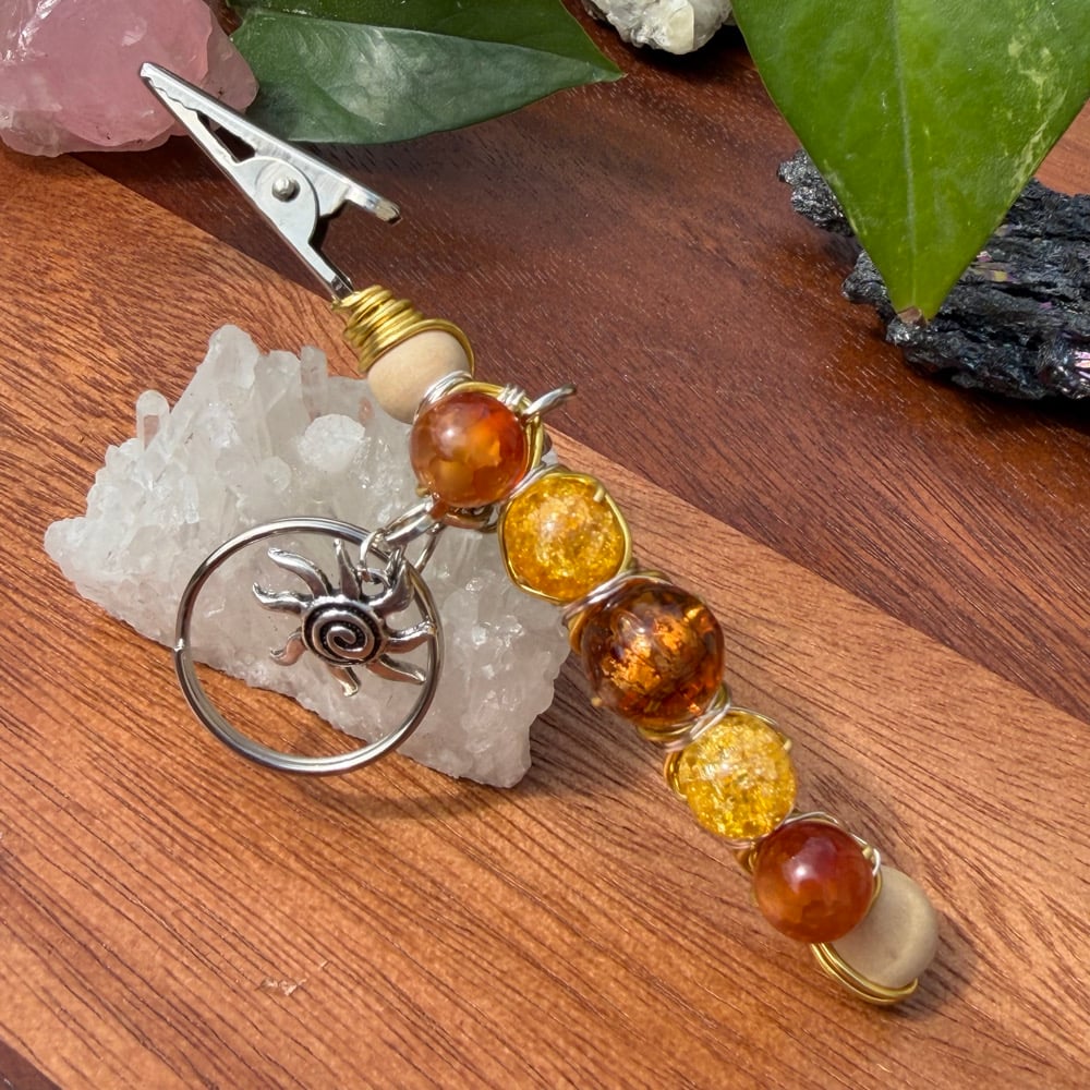 Image of sun ray clip keychain