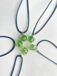 Image 1 of Swirling green planet