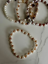 Image 7 of Starlight Shimmer Gold, Champagne, and Cream Tumbler Bracelet Stack