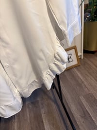 Image 2 of White ruffle bottom top 
