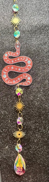 Celestial snake suncatcher