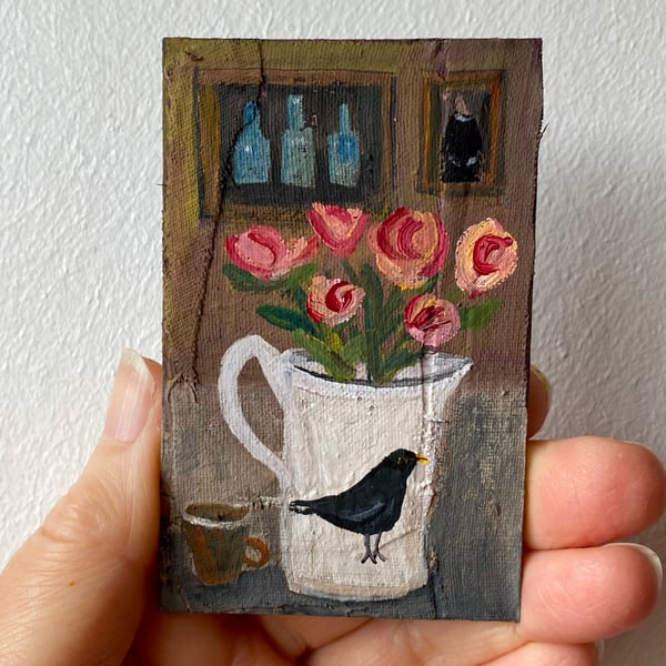 Image of still life with roses in a blackbird jug