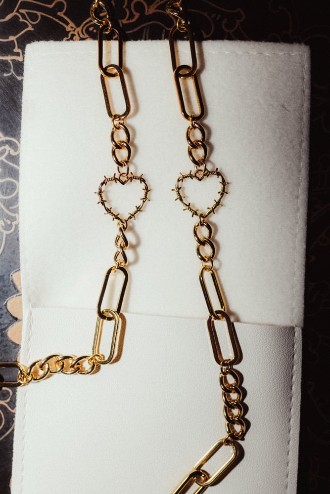 Image of gold barbed wire hearts