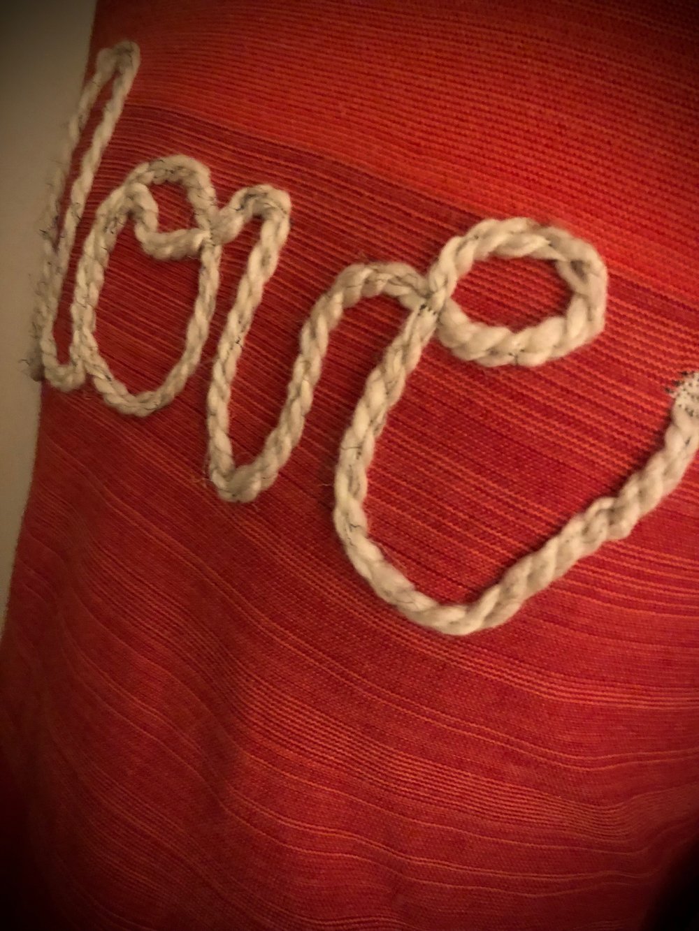 Upcycled “love” cursive yarn sweater in tri-color red