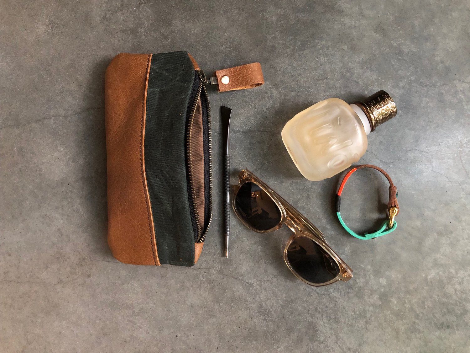 Image of Pencil case, zipper pouch in forest green waxed canvas and oiled leather