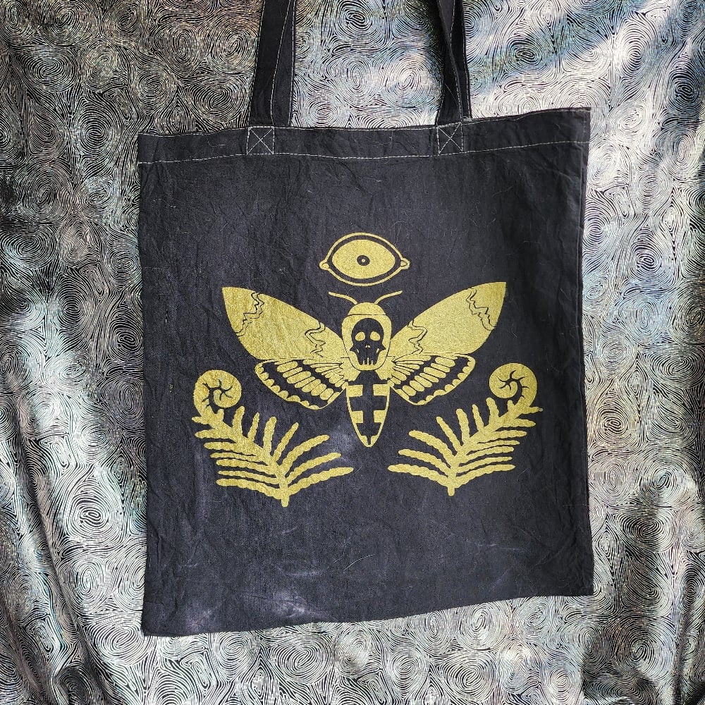 Image of deaths head moth tote bag