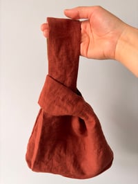 Image 2 of Green & rust knot purse | reversible 