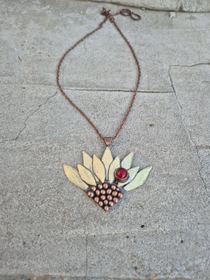Sunflower pendant with ladybug 