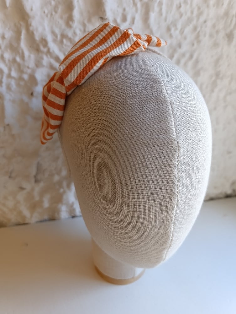 Image of Cerchietto non fiocco laterale righe bianco/arancione