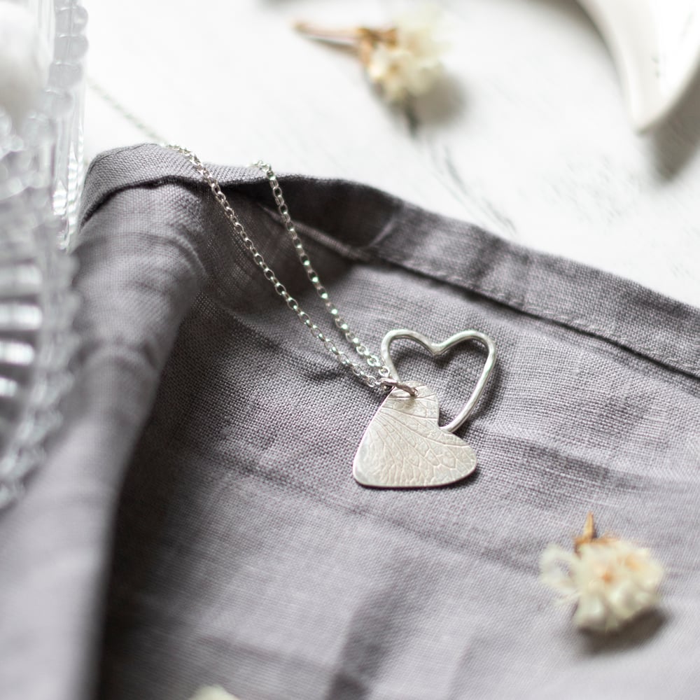 Image of Two hearts petal imprint necklace, handmade with recycled sterling silver. 